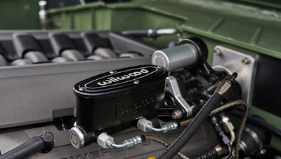 Close-up of Wilwood brake master cylinder mounted in engine compartment of Classic Ford Bronco