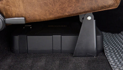 Black Kicker subwoofer speaker installed underneath seat of Classic Ford Bronco
