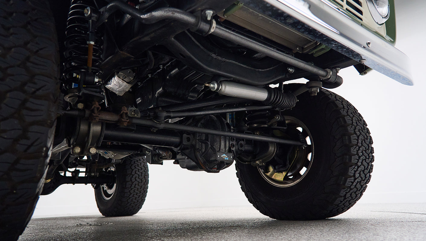 Undercarriage view showing suspension and tire tread of Classic Ford Bronco