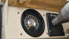 Classic Ford Bronco dashboard speedometer showing miles per hour and RPM.