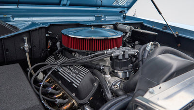 Detailed view of the engine with Bronco-powered valve cover and red air filter in Classic Ford Bronco