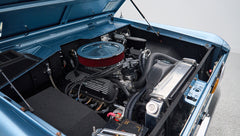 Engine compartment of Classic Ford Bronco showing detailed clean engine and components
