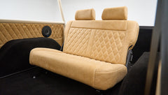 Beige leather rear bench seat with diamond stitching inside Classic Ford Bronco