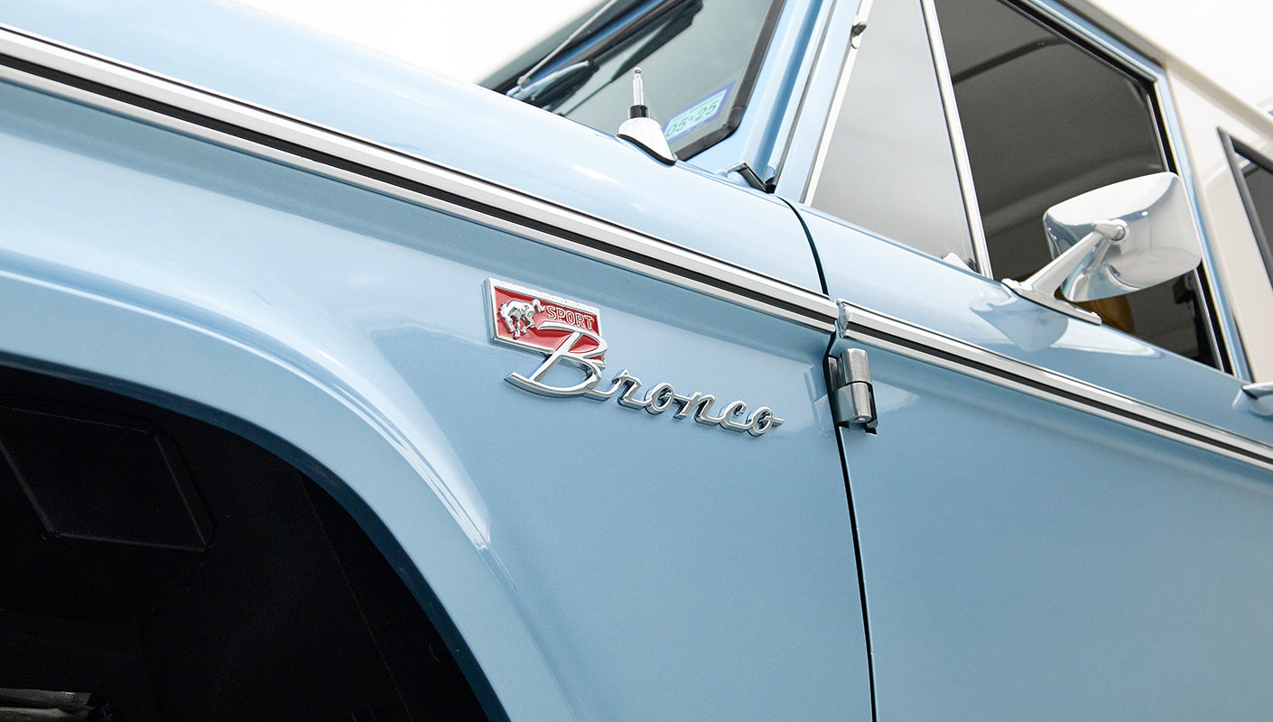 Close-up view of Classic Ford Bronco front fender badge with Sport emblem