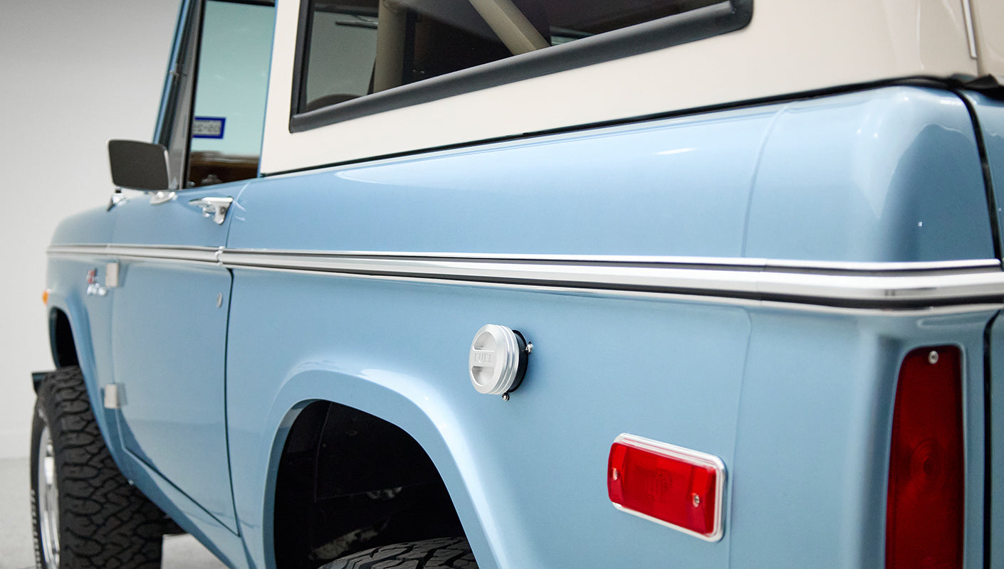 Side view of Classic Ford Bronco rear quarter panel with side marker light and fuel filler cap