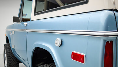 Side view of Classic Ford Bronco rear quarter panel with side marker light and fuel filler cap