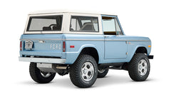 Classic Ford Bronco Brittany Blue with white hardtop viewed from rear side angle