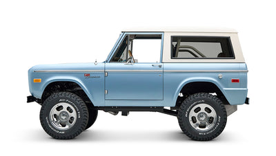 Side view of Classic Ford Bronco with light blue body and white hardtop