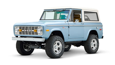 Three-quarter front view of Classic Ford Bronco in light blue with white hardtop