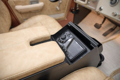 Beige leather center console with electronic controls inside Classic Ford Bronco