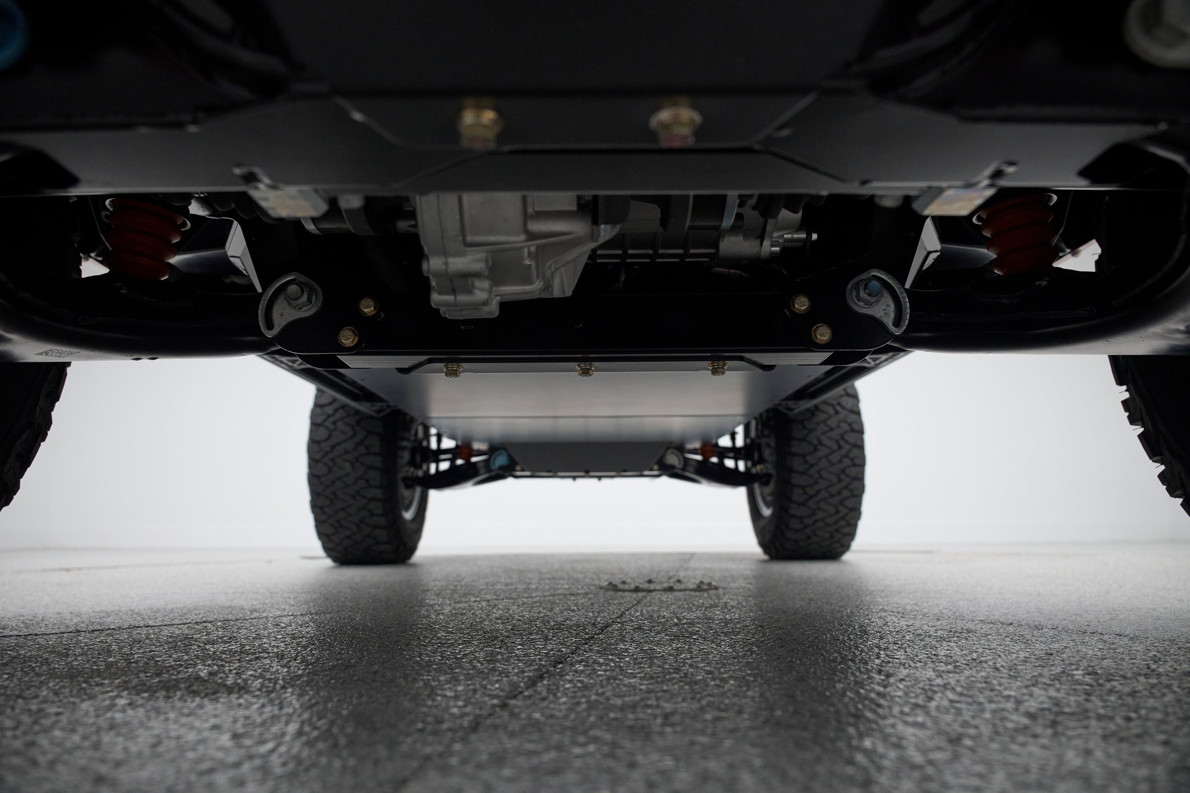 Underside view of Classic Ford Bronco showing chassis and suspension parts