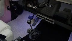 Gear shifters and air vents near driver side footwell in Classic Ford Bronco