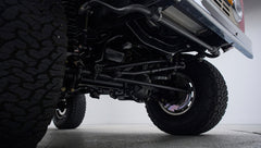 Undercarriage view showing suspension and tires of Classic Ford Bronco