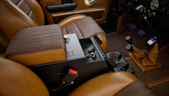 Center console and gear shifters between front seats of Classic Ford Bronco