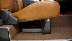 Under front passenger seat showing car audio amplifier in Classic Ford Bronco