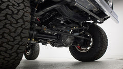 Undercarriage and front suspension components visible under Classic Ford Bronco