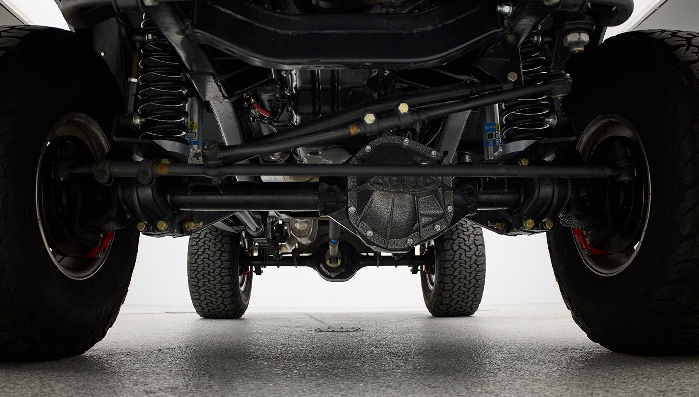 Undercarriage view showing front axle and steering components of Classic Ford Bronco
