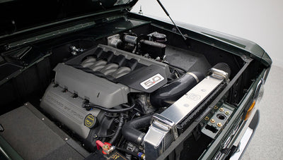 Engine bay of Classic Ford Bronco featuring a modern 5.0 liter Ford engine