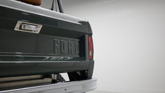 Rear tailgate of Classic Ford Bronco with embossed FORD lettering and taillight