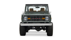 Classic Ford Bronco dark green front view with chrome bumper, grill, and amber turn signals.