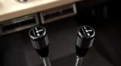 Close-up view of gearshift and transfer case levers inside Classic Ford Bronco