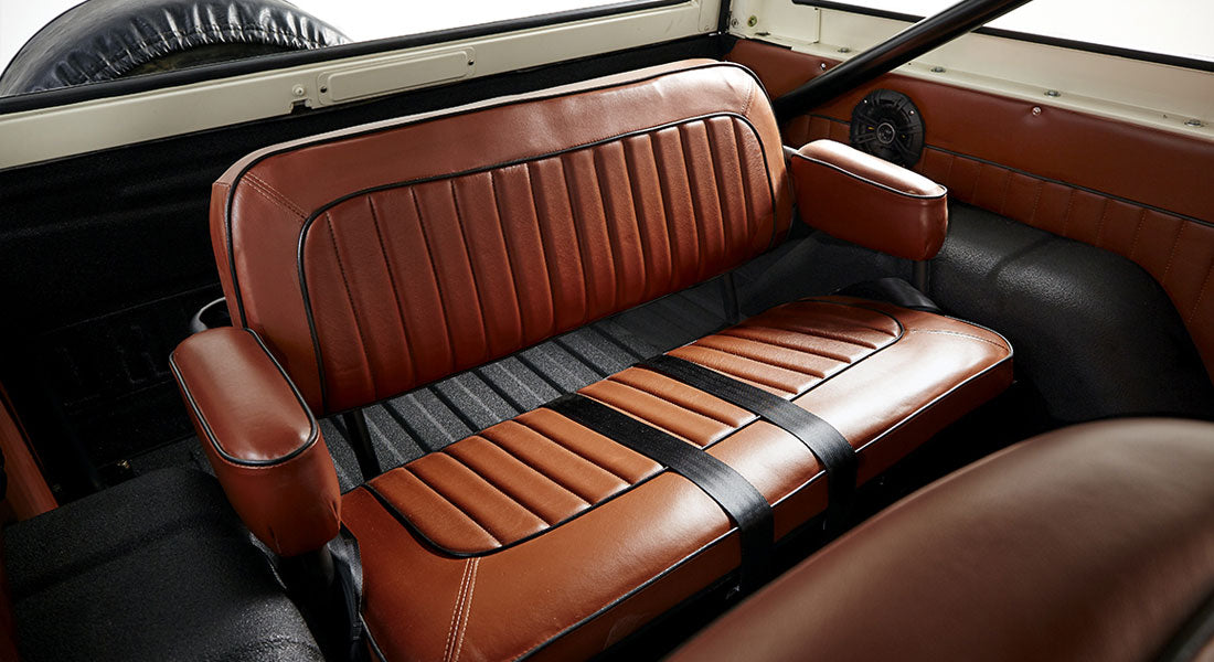 Rear brown leather bench seat with armrests inside Classic Ford Bronco