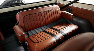 Rear brown leather bench seat with armrests inside Classic Ford Bronco