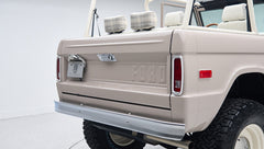Rear corner close-up of Classic Ford Bronco in dove gray focusing on tailgate and bumper