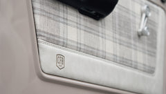 Plaid and white leather door panel trim with CFB Series logo