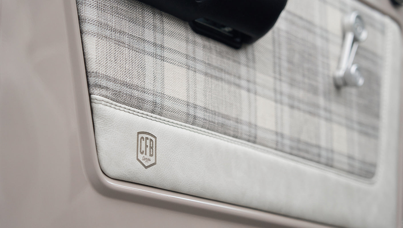 Plaid and white leather door panel trim with CFB Series logo