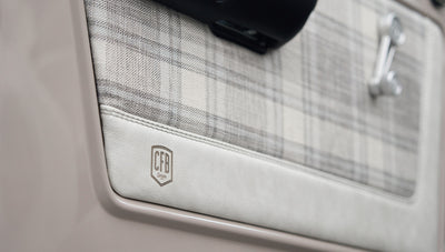 Plaid and white leather door panel trim with CFB Series logo