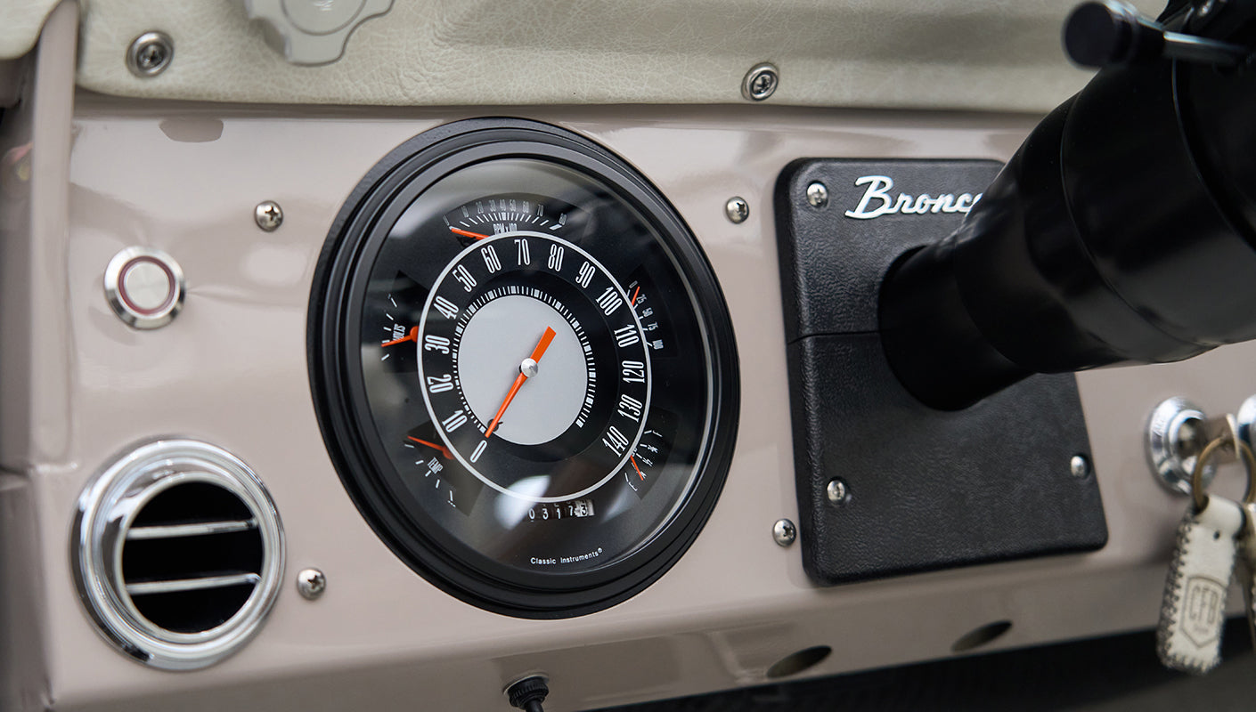 Classic Ford Bronco dashboard speedometer and Bronco emblem plate