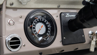 Classic Ford Bronco dashboard speedometer and Bronco emblem plate