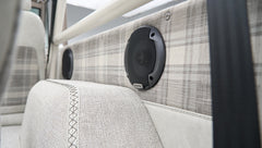 Close-up of Alpine speaker and plaid interior detail in Classic Ford Bronco
