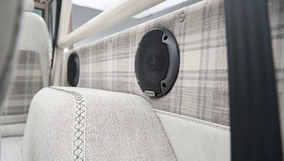 Close-up of Alpine speaker and plaid interior detail in Classic Ford Bronco