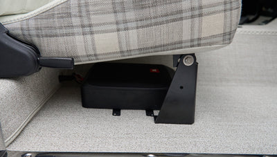 Close-up underside of a seat showing black mounted speaker in Classic Ford Bronco interior