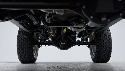 Underside view showing rear axle and tires with suspension details