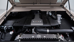 Close-up of 5.0-liter engine with CFB radiator and intake parts under hood