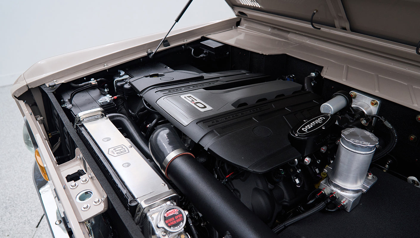 Engine compartment of Classic Ford Bronco with a 5.0 liter V8 engine and radiator