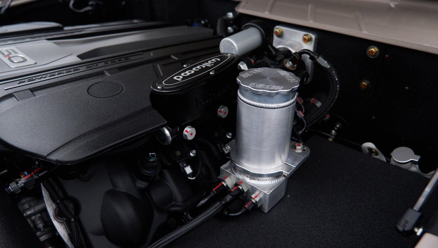 Close-up of engine components and Wilwood brake master cylinder in Classic Ford Bronco