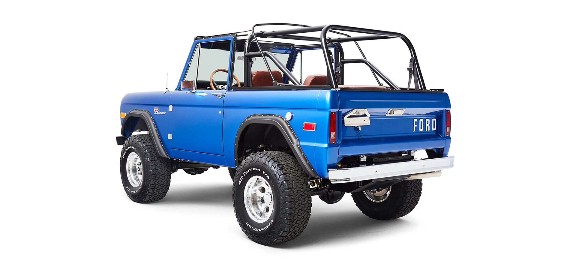 Rear angled view of Classic Ford Bronco driver side with visible suspension and off-road wheels