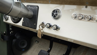 Dashboard of Classic Ford Bronco with ignition keys and control knobs visible