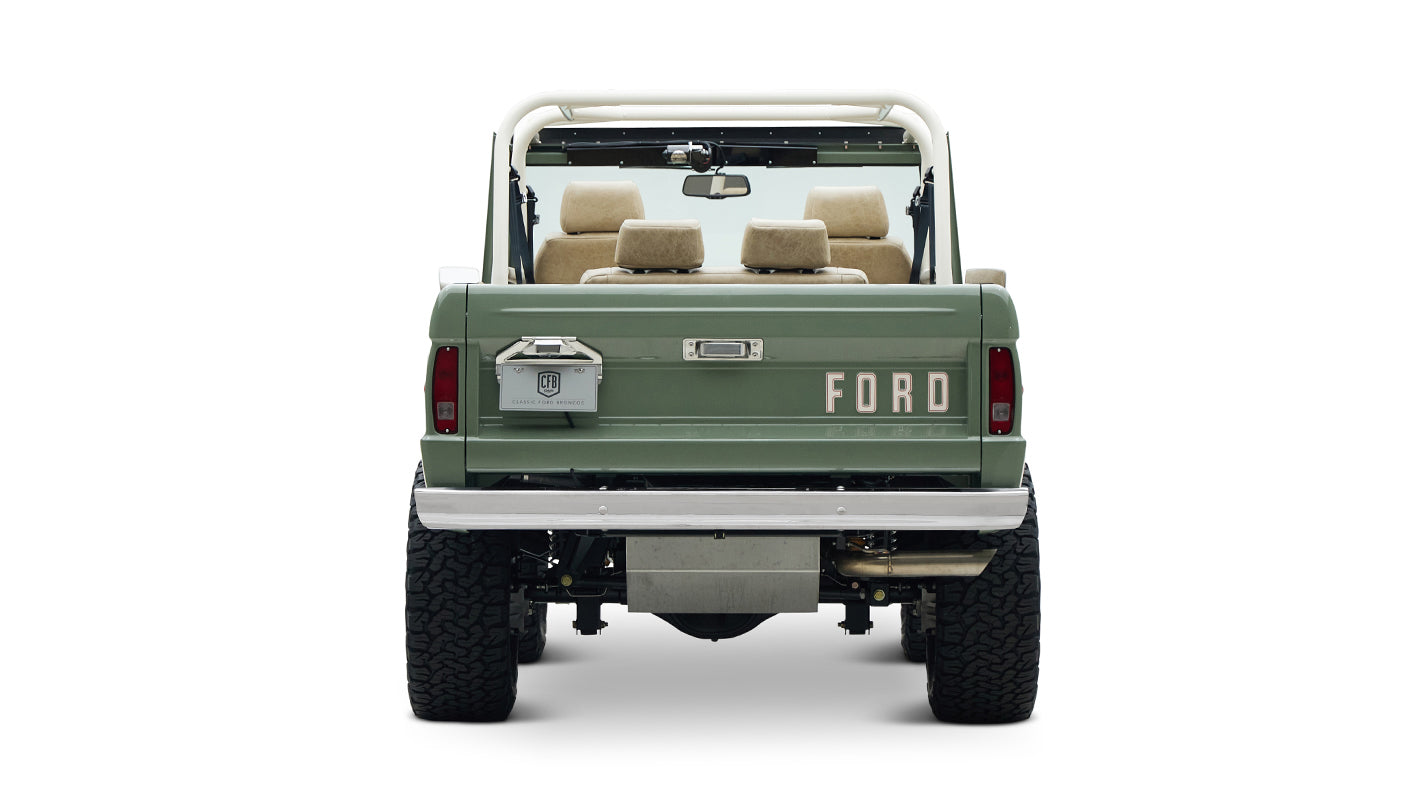 Classic Ford Bronco rear view highlighting FORD lettering on tailgate and heavy-duty tires