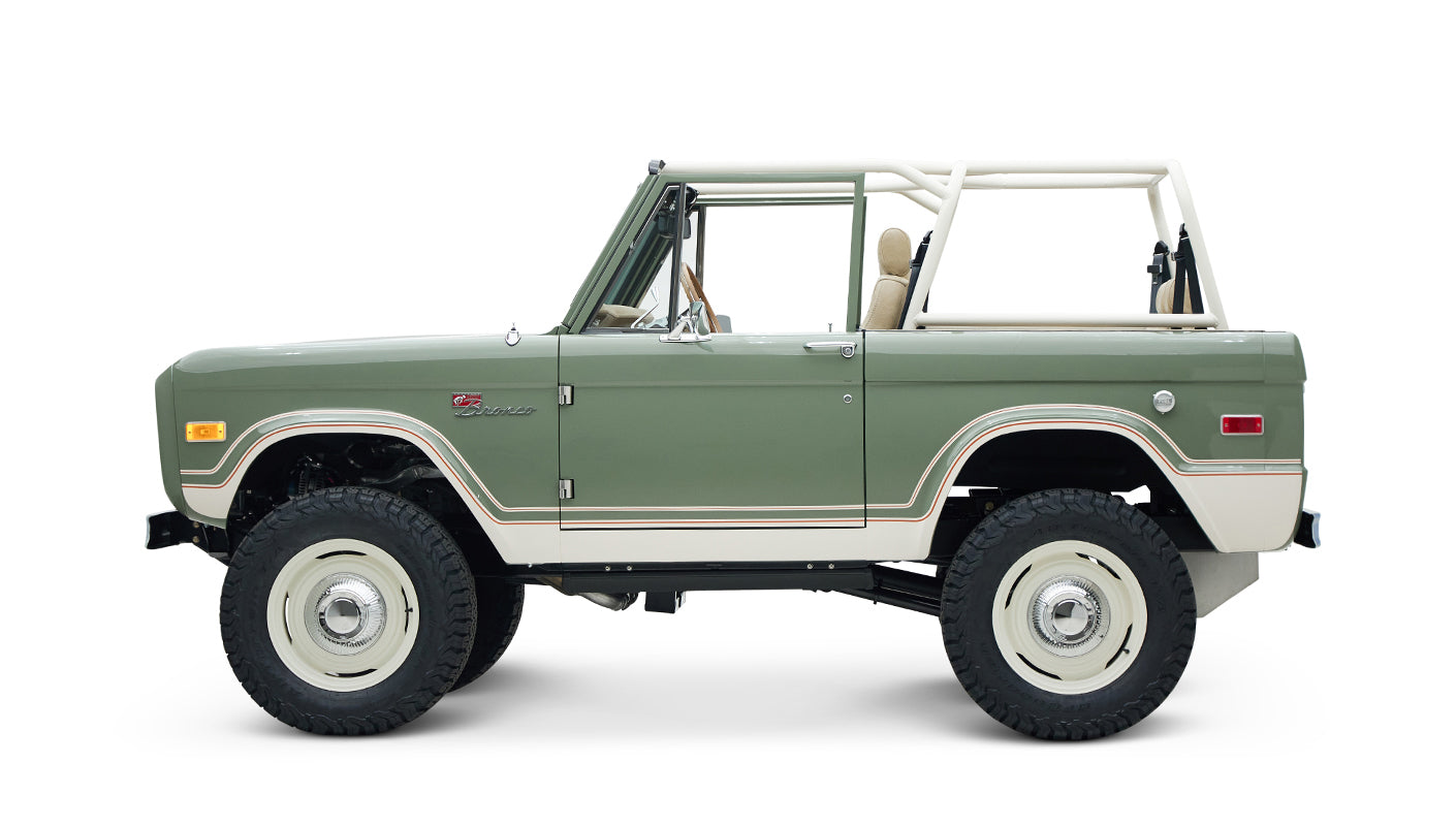Side view of classic Ford Bronco showing boxwood green body and white lower trim