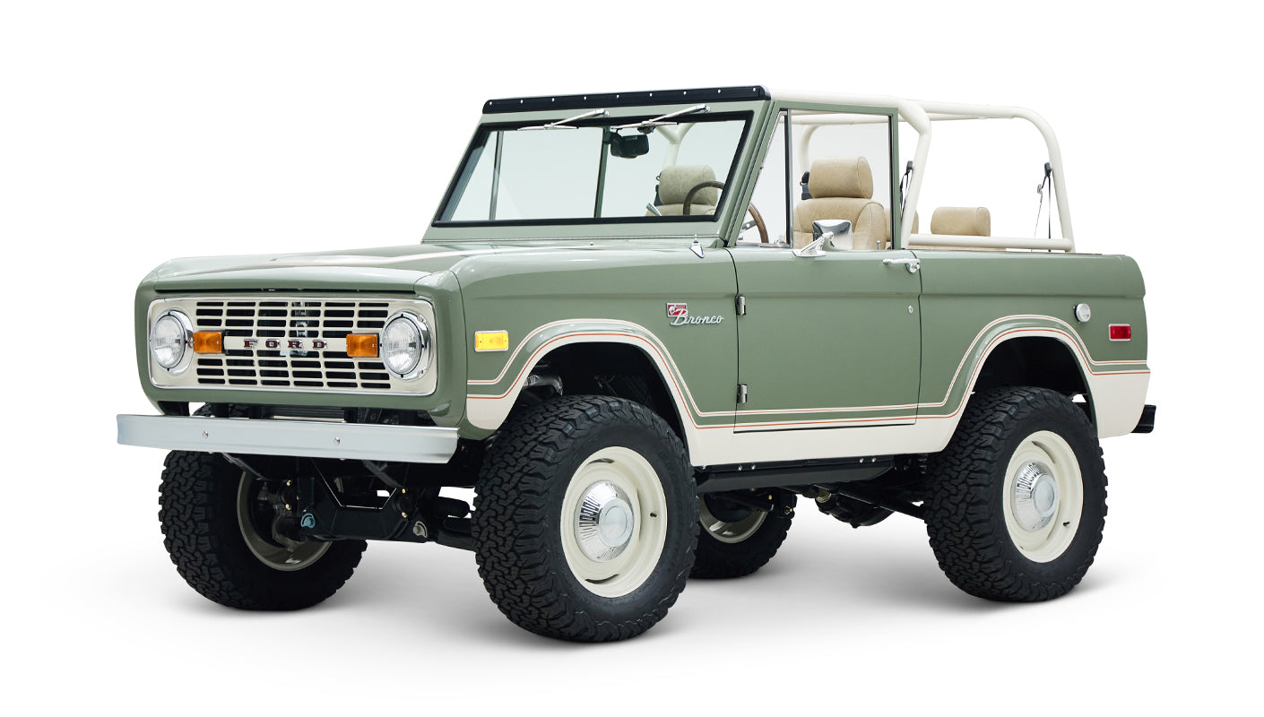 Classic Ford Bronco in boxwood green with beige interior and white roof frame