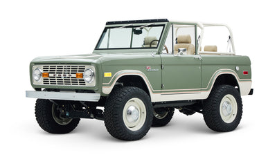 Classic Ford Bronco in boxwood green with beige interior and white roof frame