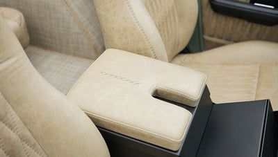 Beige leather padded armrest in the interior cabin of Classic Ford Bronco