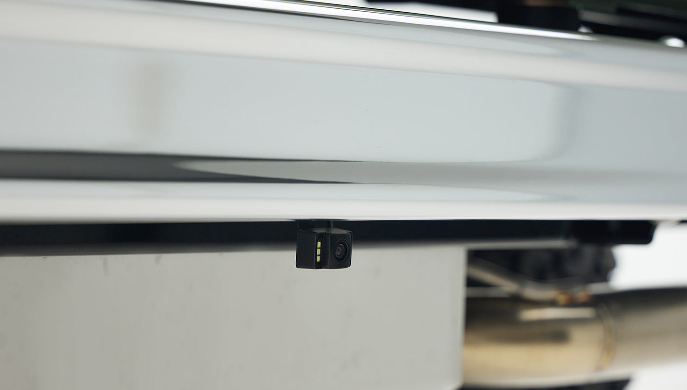Rear backup camera mounted below the tailgate of a Classic Ford Bronco