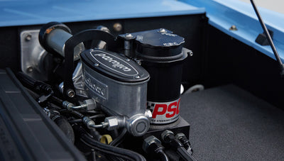 Close-up of steering system components labeled PSC and Wilwood in Classic Ford Bronco engine bay