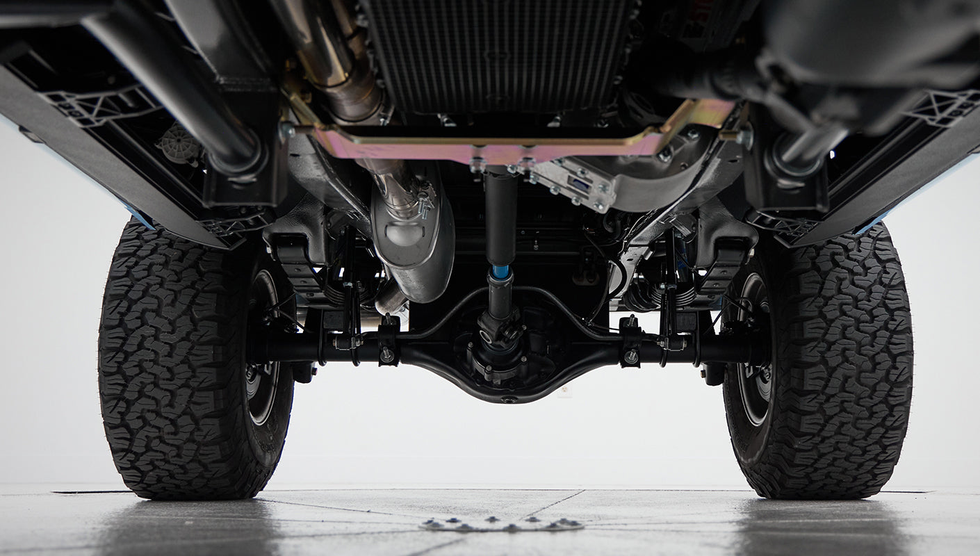 Underneath view of rear axle, drive shaft, and exhaust system of Classic Ford Bronco